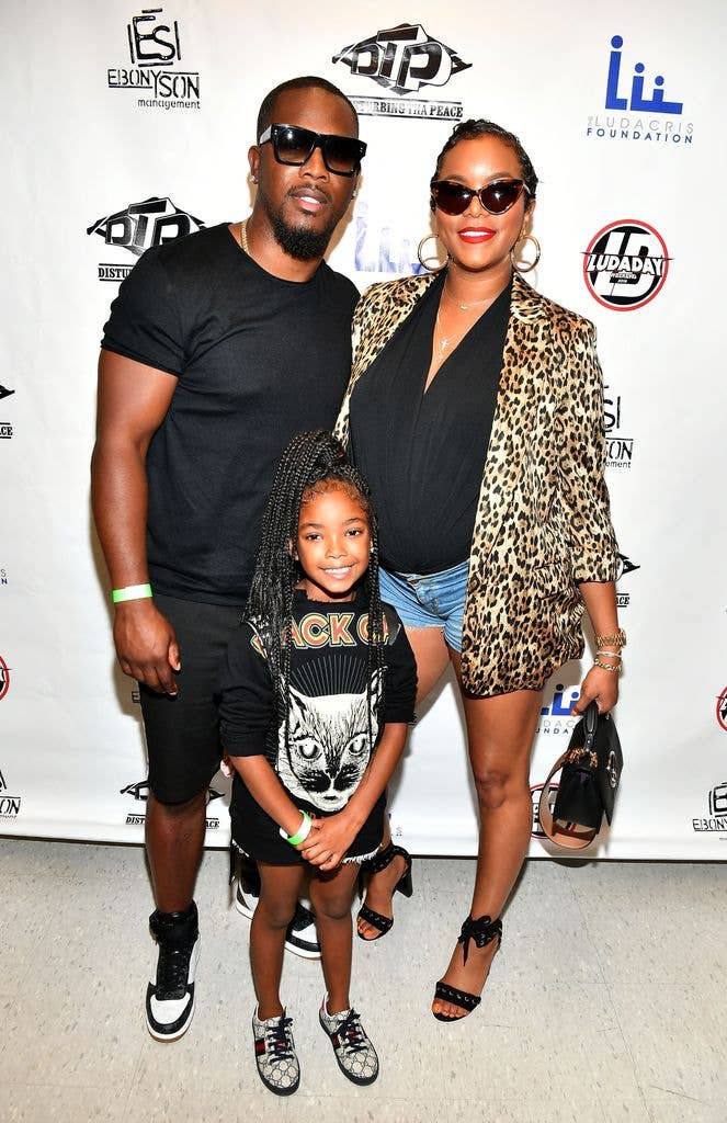 Tommicus Walker and LeToya Luckett pose with their daughter backstage at 2018 LudaDay Celebrity Basketball Game at Morehouse College - Forbes Arena on September 2, 2018 in Atlanta, Georgia. 