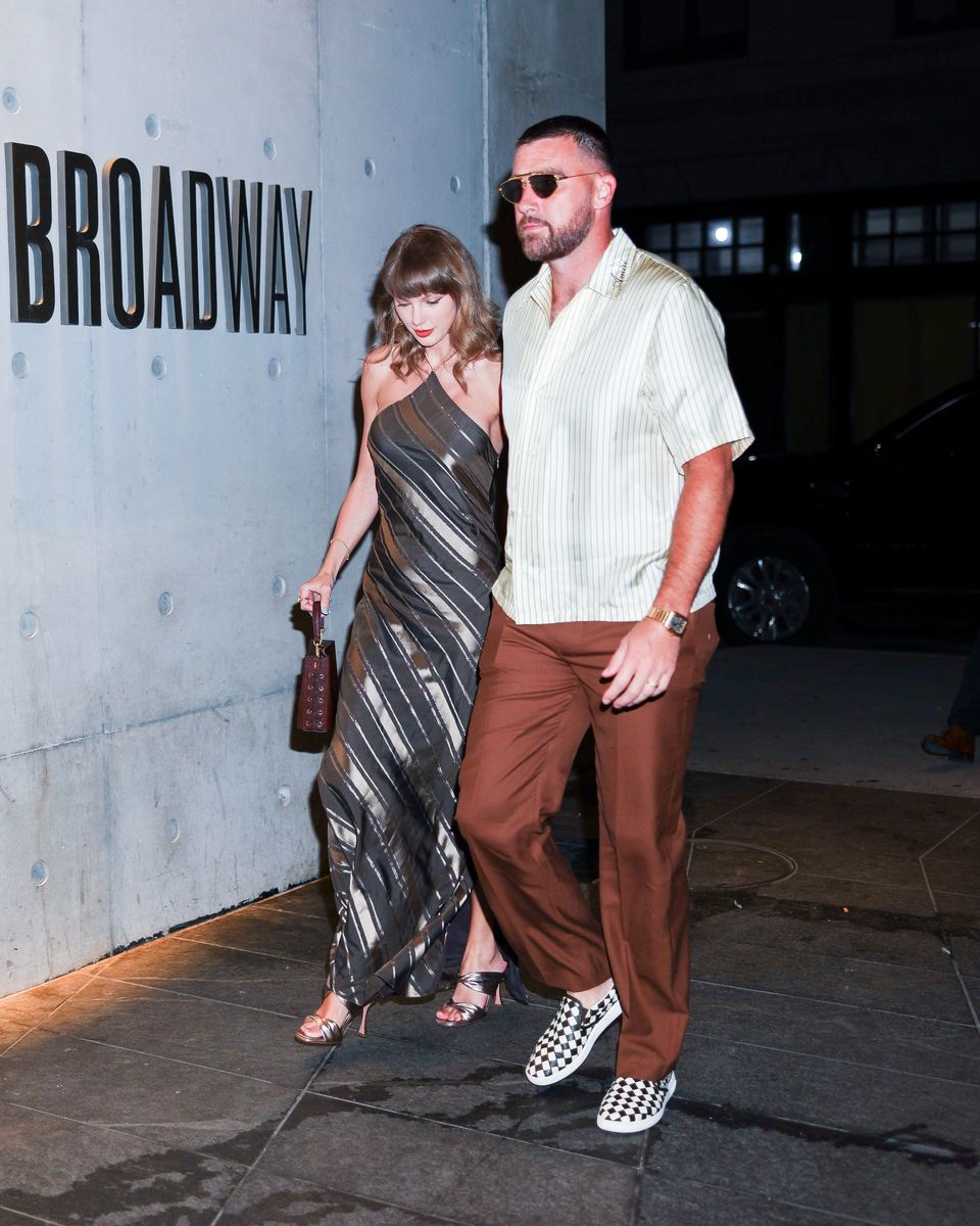 Travis kept it casual in checkered Vans while Swift rocked heels