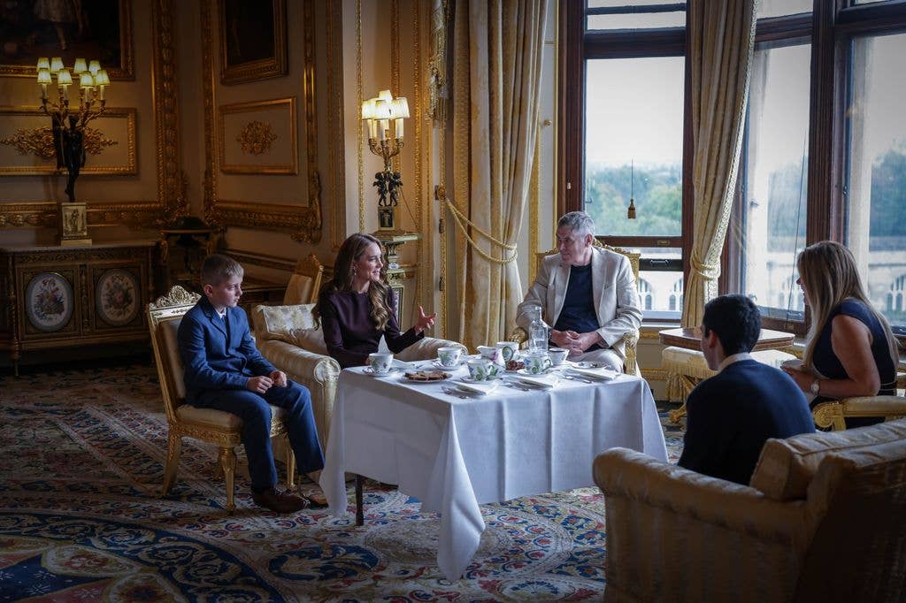The royal sat down and chatted with guests over tea and cake