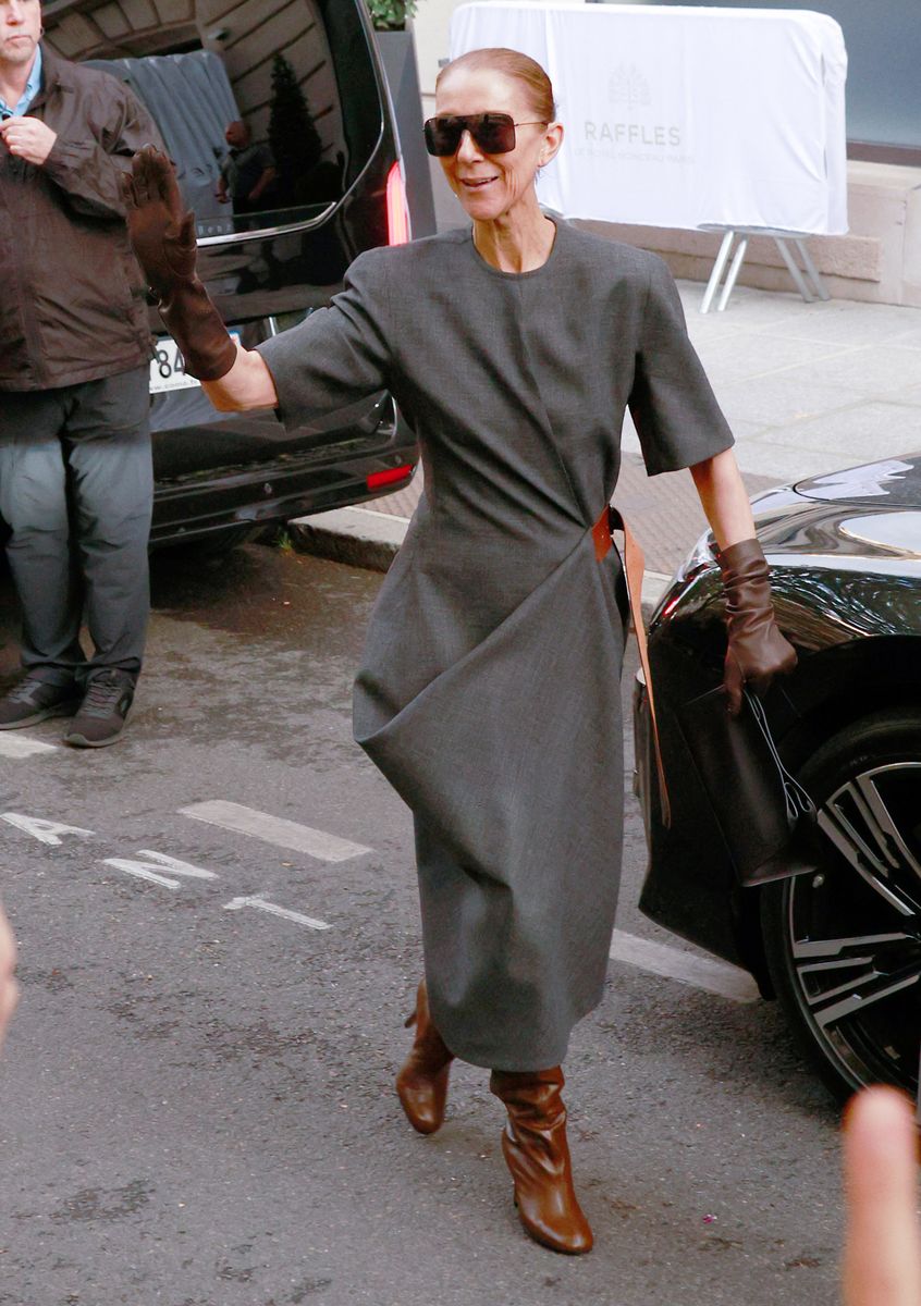 The superstar stepped out in a dramatic charcoal gray dress paired with brown leather gloves and knee-high boots as she headed to rehearsals.