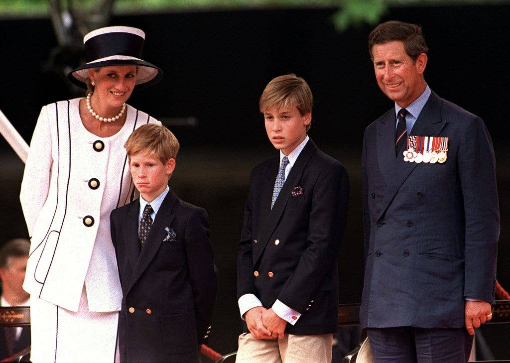 Prince Charles and his sons in suits alongside Diana, at an engagement in 1994