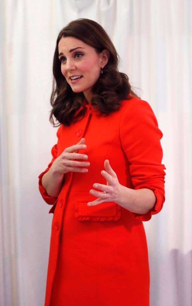 Princess Kate wearing an orange dress
