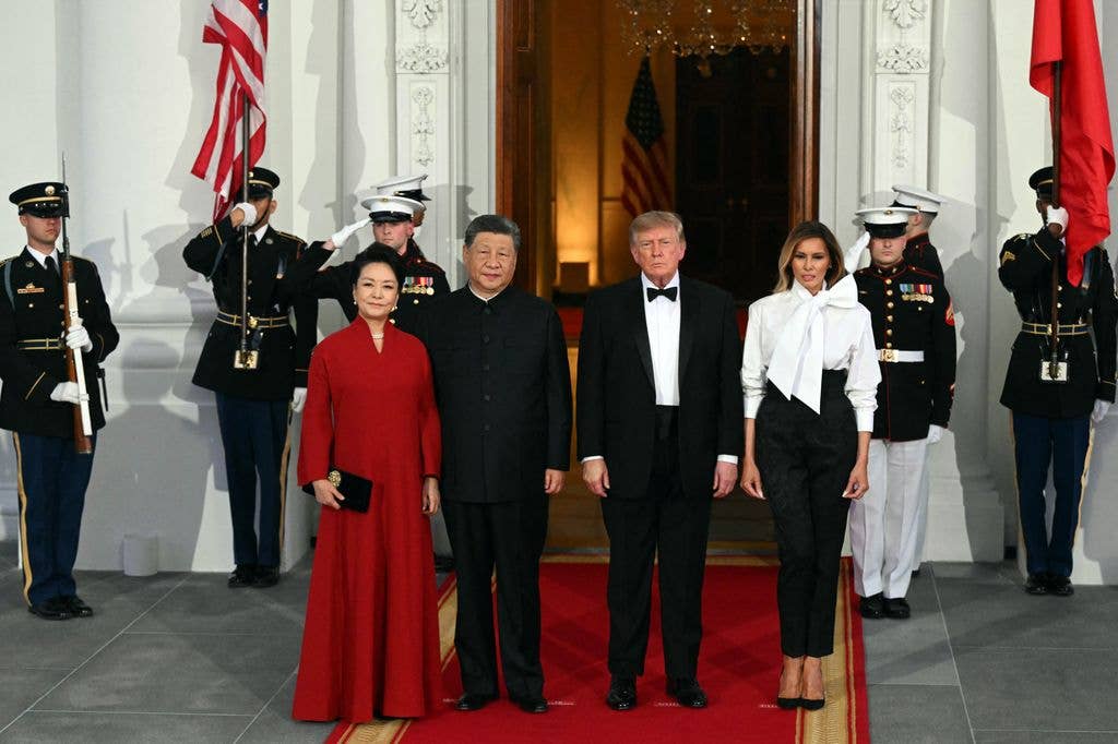 Melania wearing a Saint Laurent blouse and Dolce & Gabbana pants