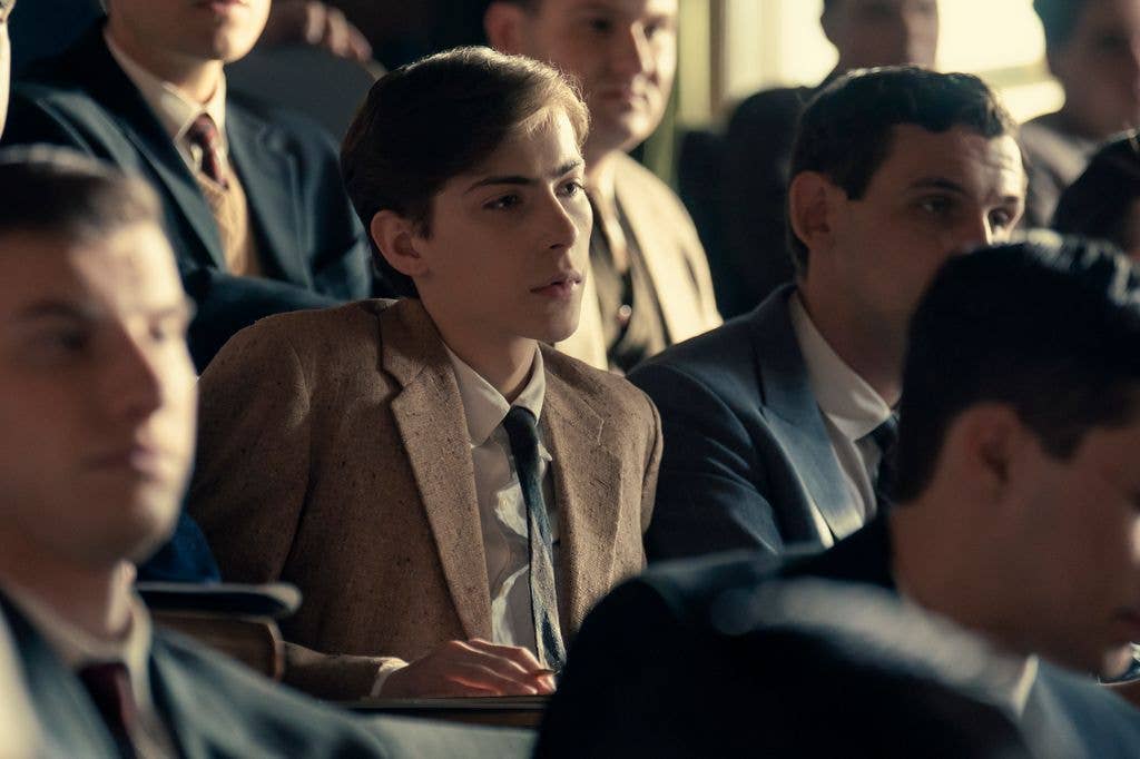 Jacob Tremblay, in a brown suit, sits among other students in a classroom.