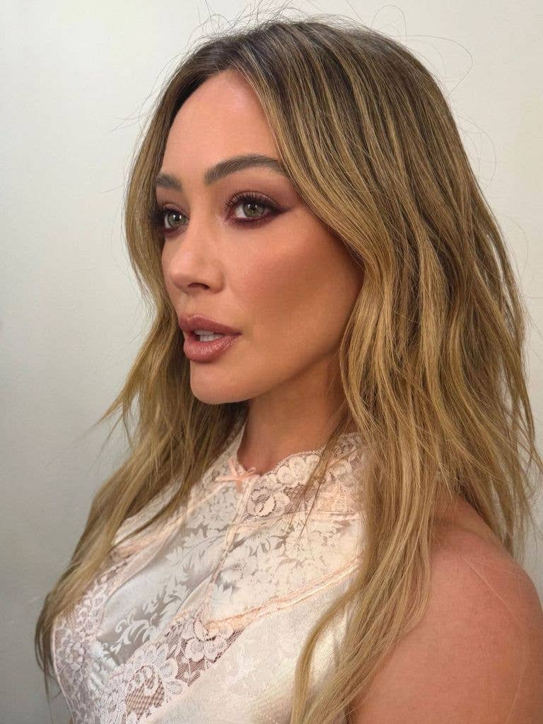 Hilary Duff side profile, wearing glam makeup