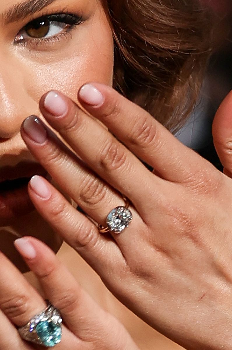 Zendaya showing her wedding ring.