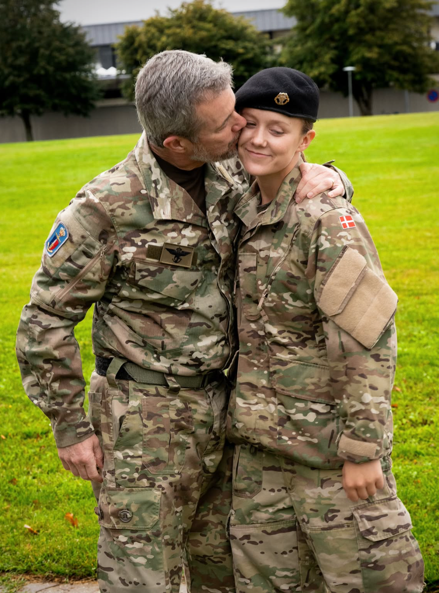 King Frederik proudly kissed his daughter on the cheek as they reunited in matching military uniforms.