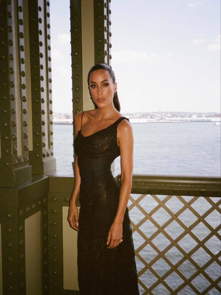 Ines in a black lace dress