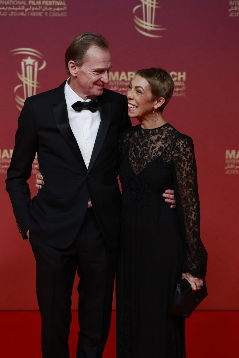 French film producer Nicolas Altmayer (L) and Director of Public Relations for Dior Couture Mathilde Favier
