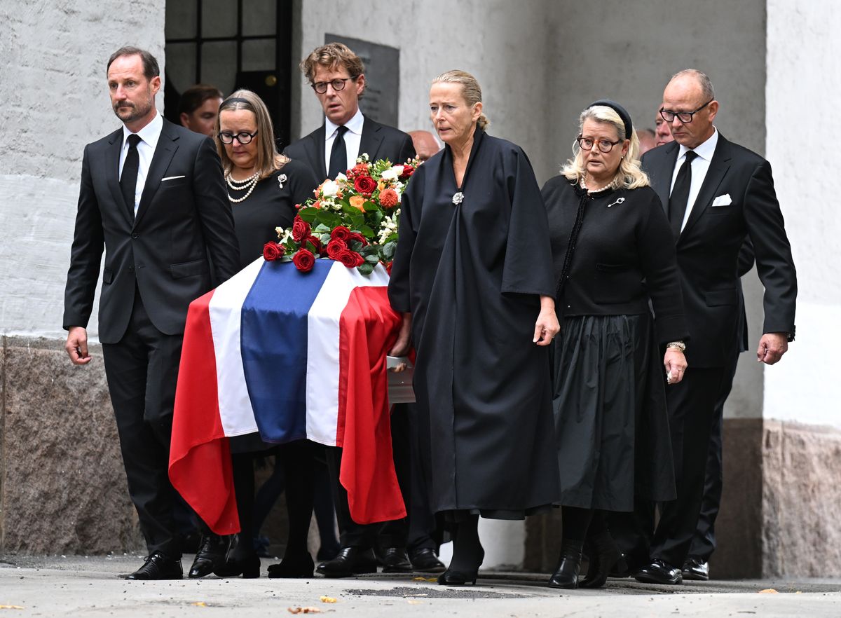 King Haakon helped carry Princess Astrid’s flag-draped coffin following the funeral service in Oslo.