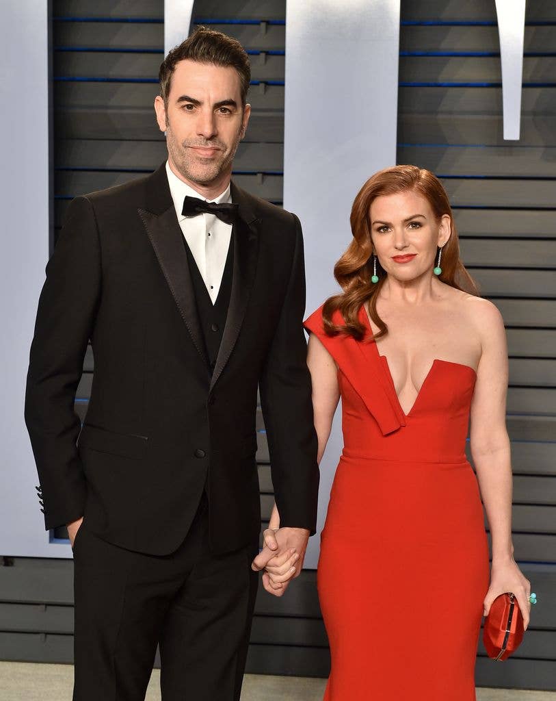 photo of isla fisher and sacha baron cohen holding hands on red carpet