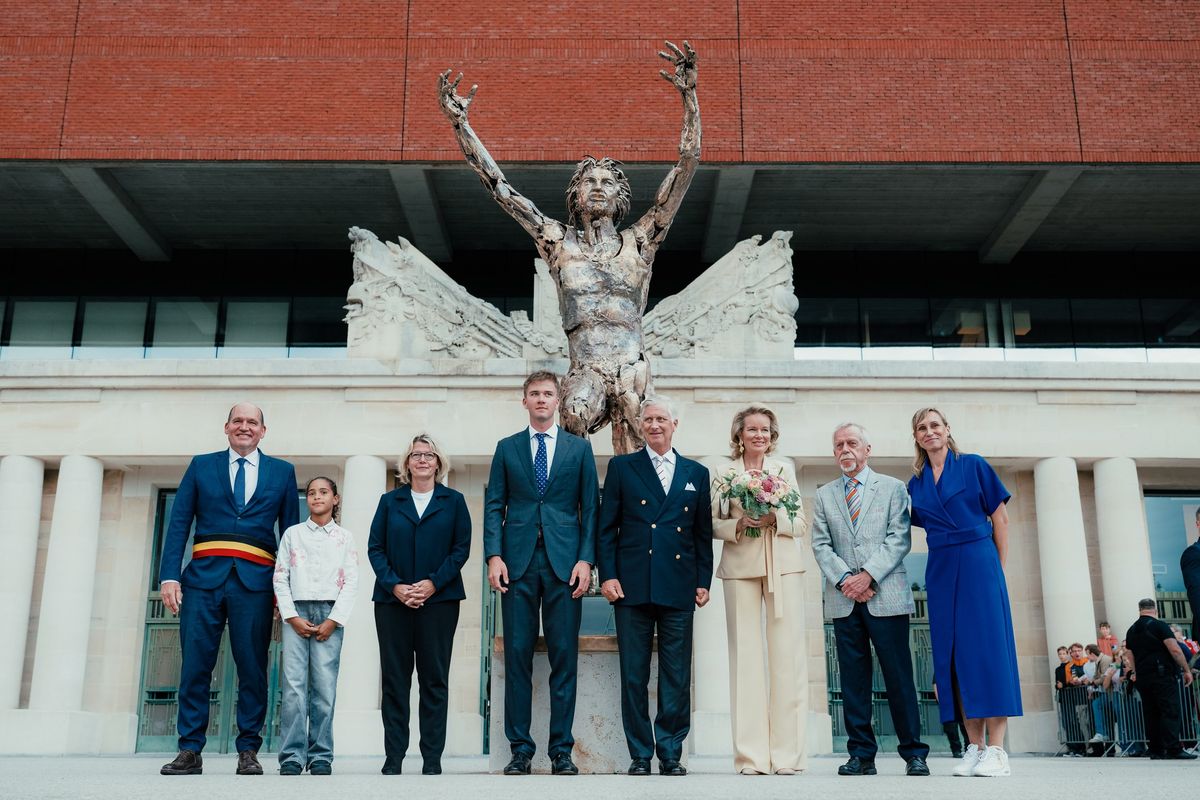 Prince Gabriel stood alongside his parents and other guests beneath the monument honoring Belgian Olympic athlete Ivo Van Damme.