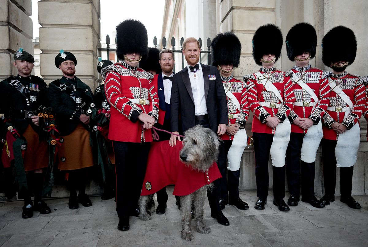 Prince Harry poses with members of the Band of The Irish Guards as he arrives at the Invictus Games Foundation's inaugural Invictus Spirit Awards