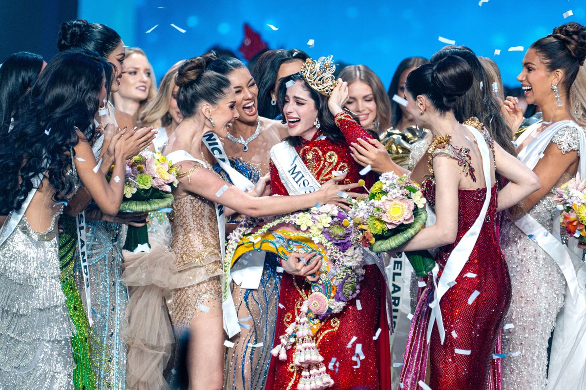 Fatima Bosch Fernández of Mexico (center) is celebrated after winning the title of Miss Universe 2025 (74th edition) at the final competition held at IMPACT Challenger Hall 2 in Nonthaburi, Thailand. The new queen from Mexico claimed the crown, while the representative of the host country, Veena Praveenar Singh from Thailand, achieved the remarkable position of 1st Runner-Up. The Miss Universe 2025 (74th edition) pageant showcased a massive field of talent, with a total of 120 beautiful contestants from around the world participating in the competition. (Photo by Arnun Chonmahatrakool/Thai News Pix/LightRocket via Getty Images)