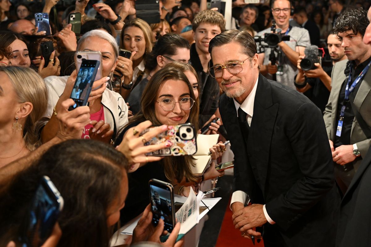 Brad Pitt signs autographs and taking selfies with fans before the "Heart of the Beast" Special Screening