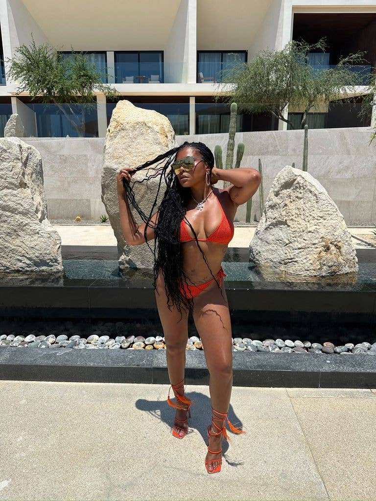 She donned a bold orange bikini 
