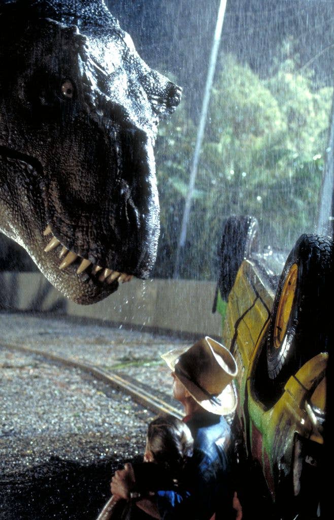 Actor Sam Neill as Dr. Alan Grant and Ariana Richards as Lex try to avoid the attentions of a Tyrannosaurus Rex in a scene from the film 'Jurassic Park', 1993.