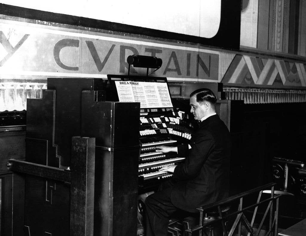 A man playing the organ at a theatre in Croydon in 1929.