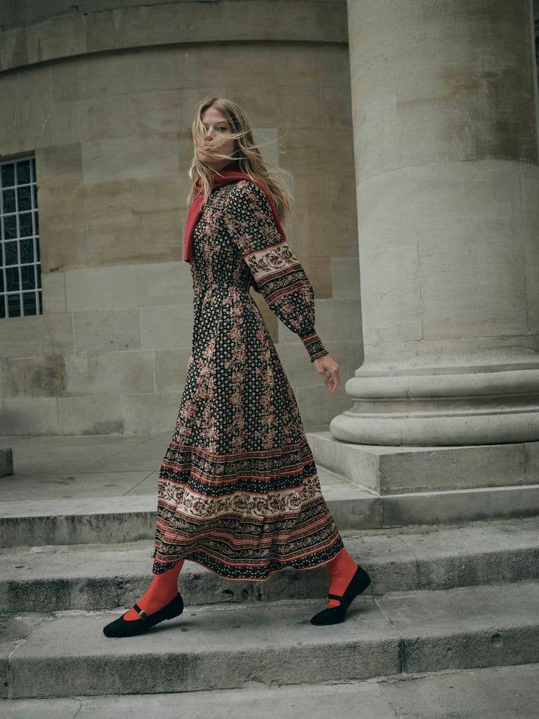 model in fatface maxi dress in paisley print on stairs