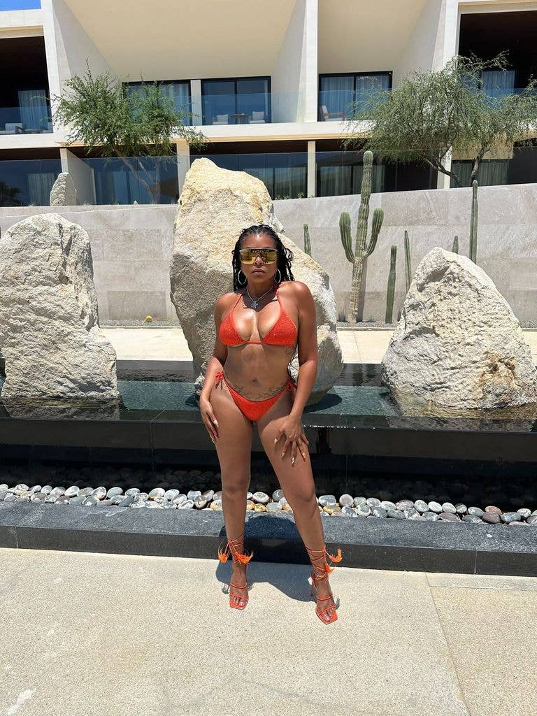 Taraji P. Henson wearing orange bikini and matching heels