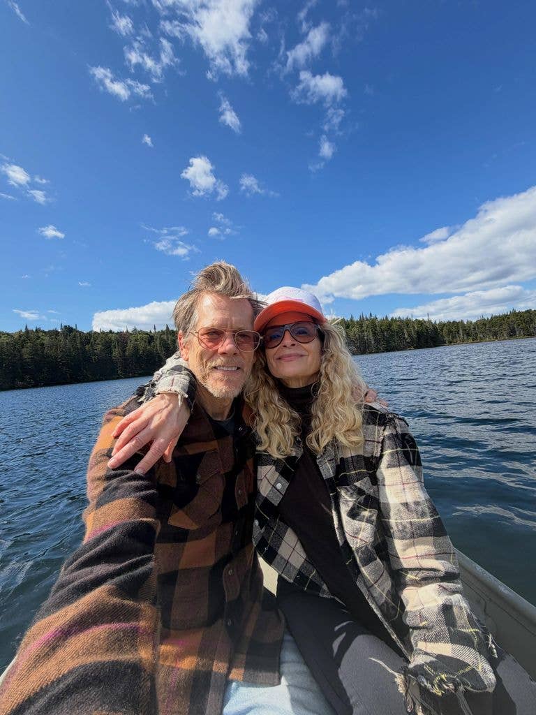 Kevin Bacon and Kyra Sedgwick on the lake on a canoe