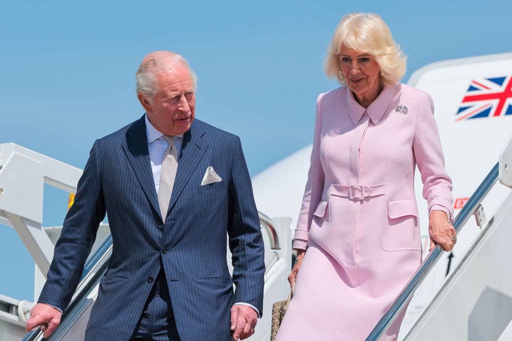 King Charles and Camilla disembarking plane