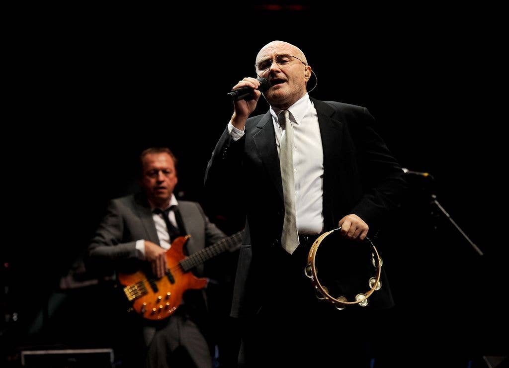 Musicians Mark King (L) and Phil Collins perform at The Prince's Trust Rock Gala 2010 supported by Novae at the Royal Albert Hall on November 17, 2010 in London, England.  (Photo by Ian Gavan/Getty Images)
