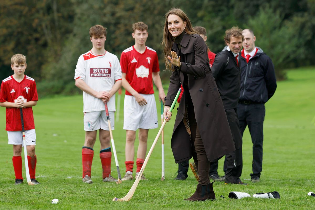 Kate Middleton showed off her sporty side as she tried her hand at shinty during her first official visit to the Isle of Bute.