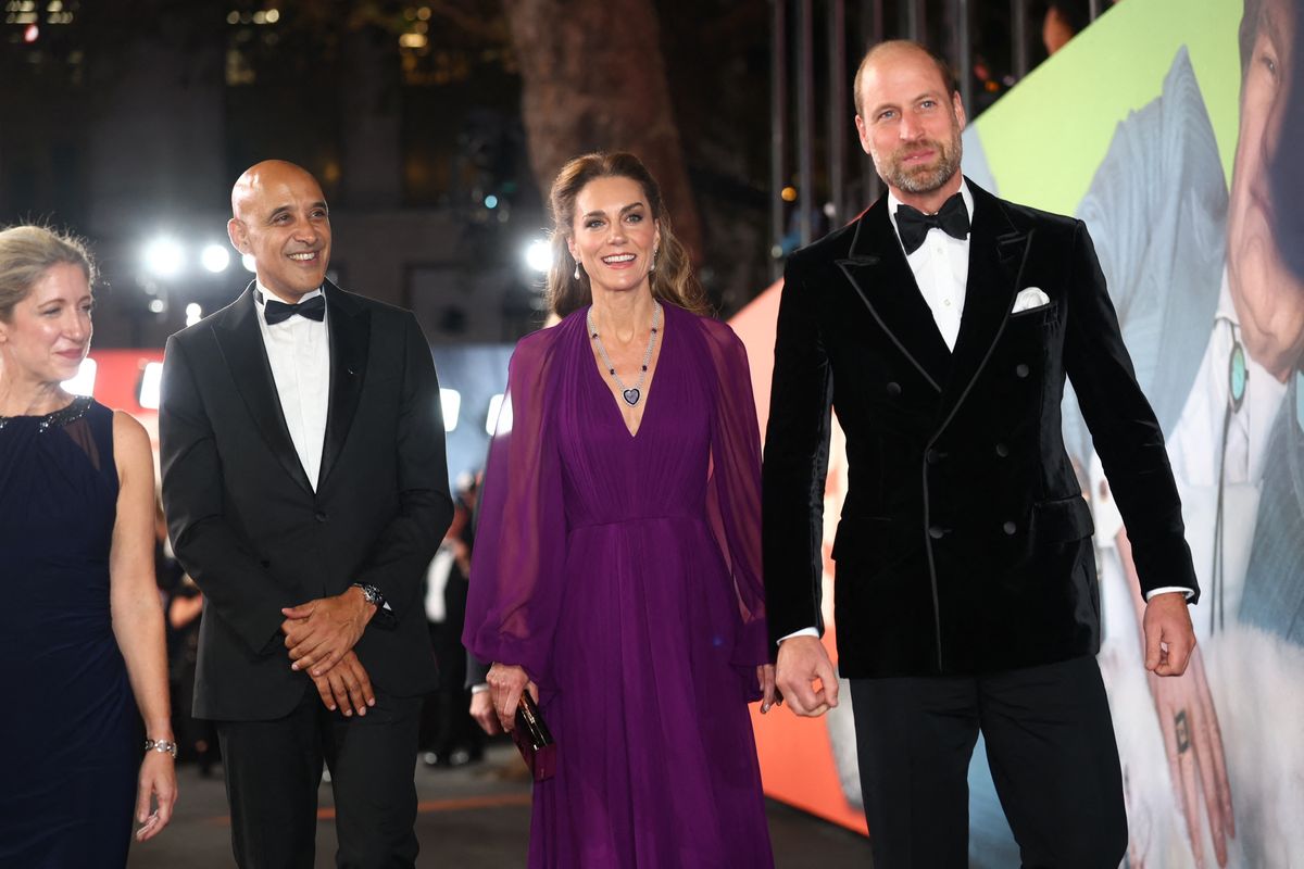 Prince William coordinated with his wife in a black velvet double-breasted tuxedo jacket as the couple arrived for the Royal Film Performance.